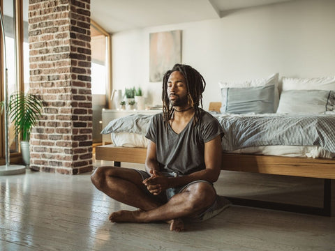 Serene man enjoying a peaceful slow meditation morning ritual  in soft natural daylight Alpha Fungi