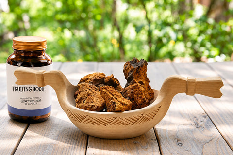 mushroom supplement bottles with ingredient labels on a wooden table