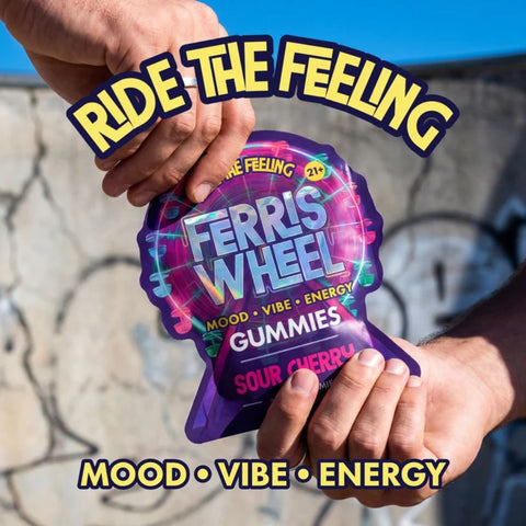 Close up of Ferris Wheel Sour Cherry gummy held in hand showing texture and size for daily mood support
