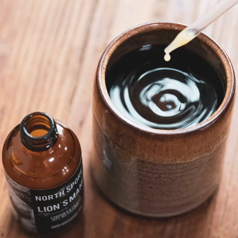 Dropper applicator and bottle cap of North Spore functional mushroom extract