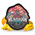 Packaging for Tre House Magic Mushroom Gummies with a colorful design and an image of mangoes. The package indicates the product is 15 gummies and has a juicy mango flavor.